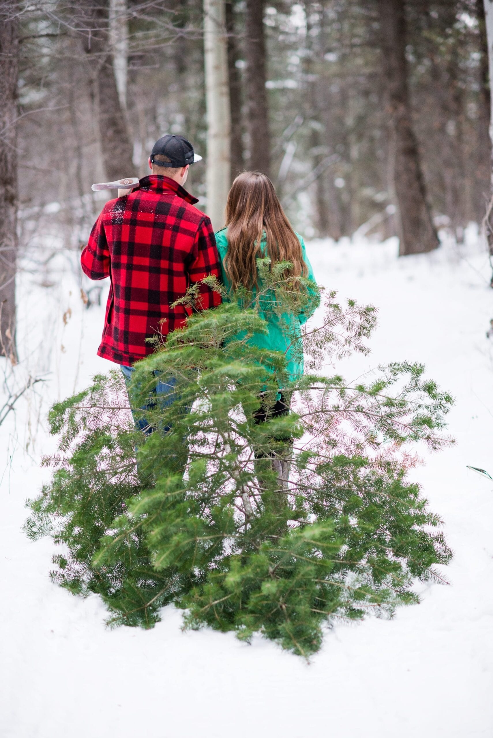 Cutting Down a Christmas Tree Anniversary Session by Michelle & Logan