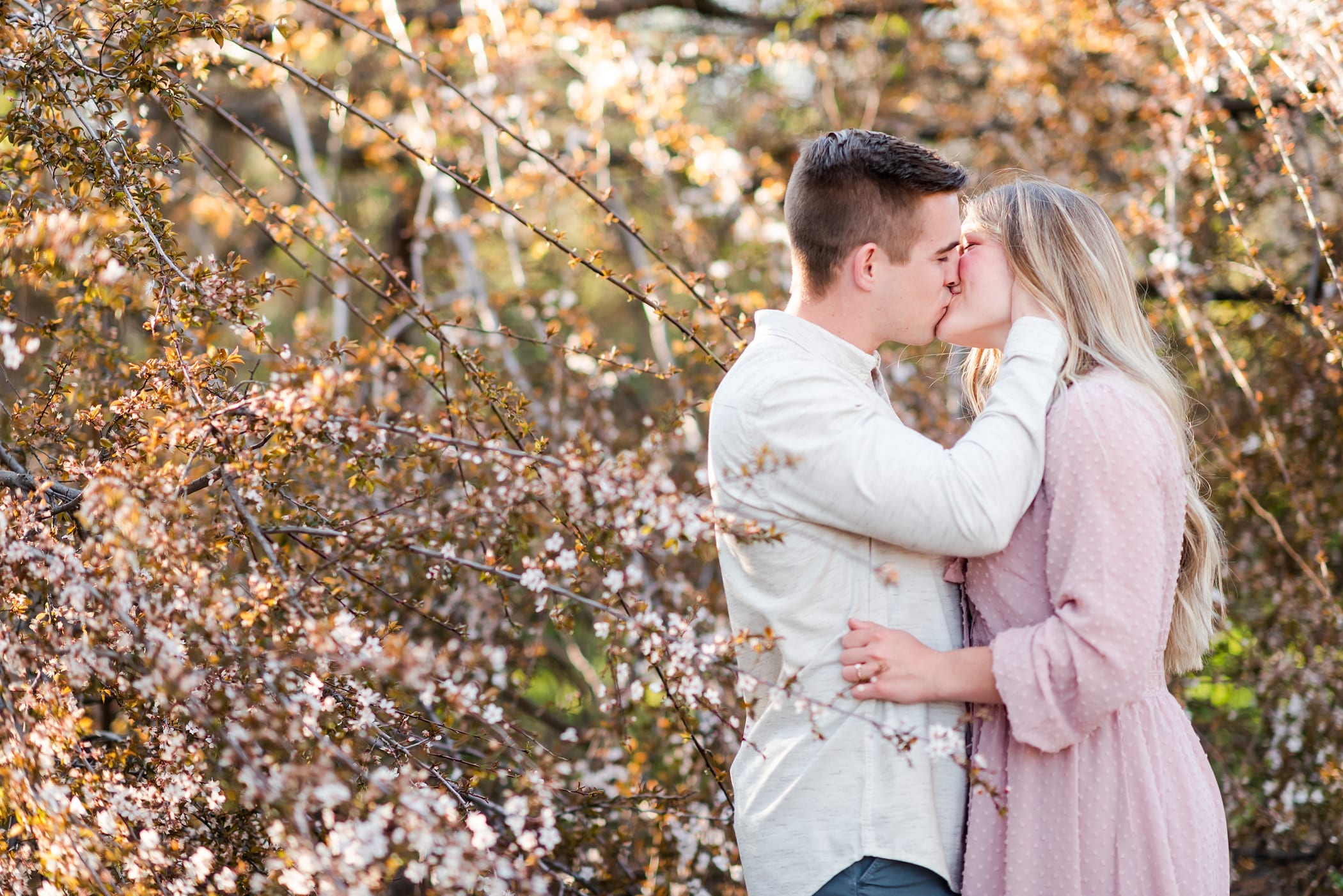 Blossom spring engagements in blush dress and button up shirt at Boise Idaho