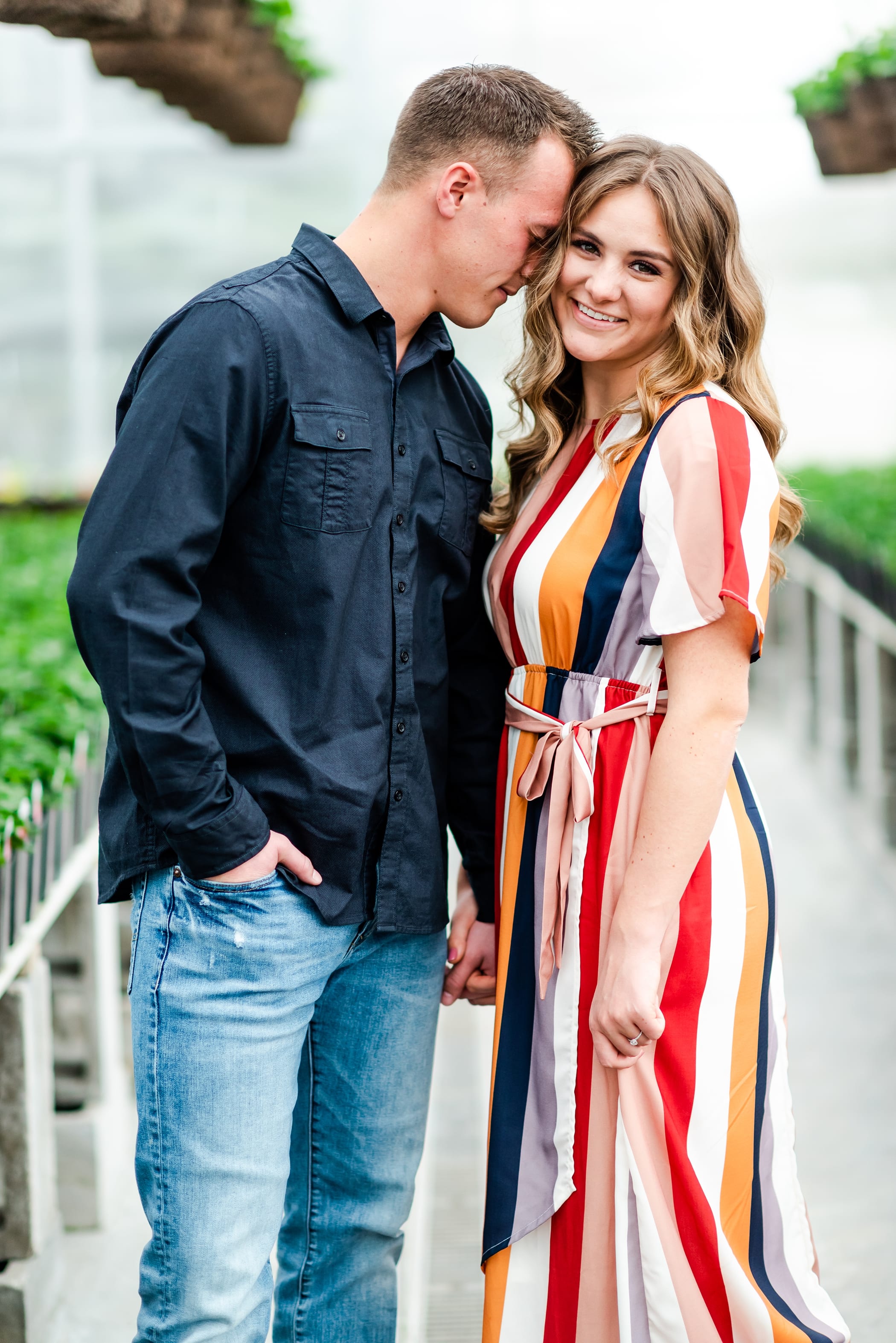 Spring engagement session in a greenhouse