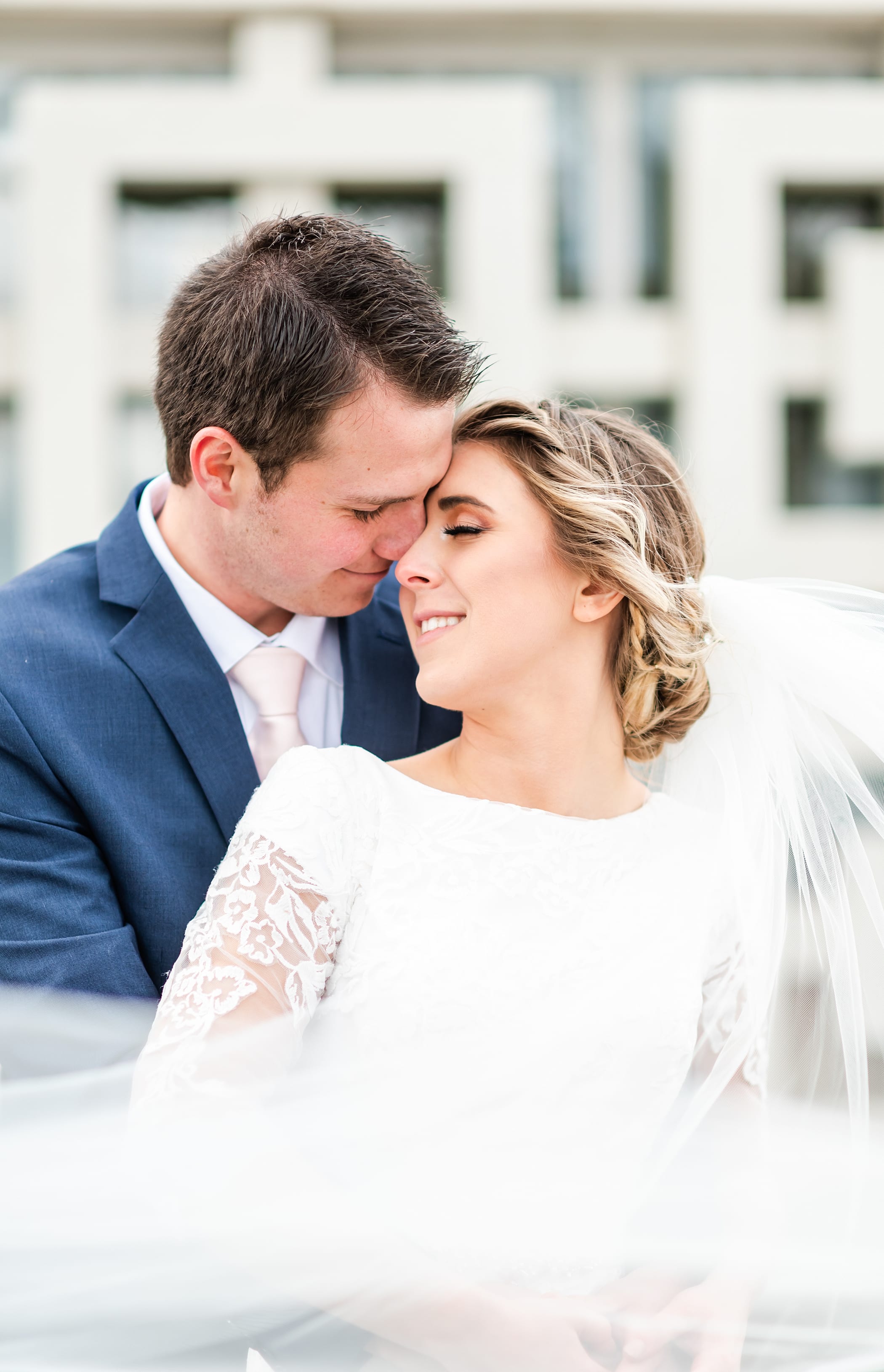 Romantic portrait at the Idaho Falls temple with long veil