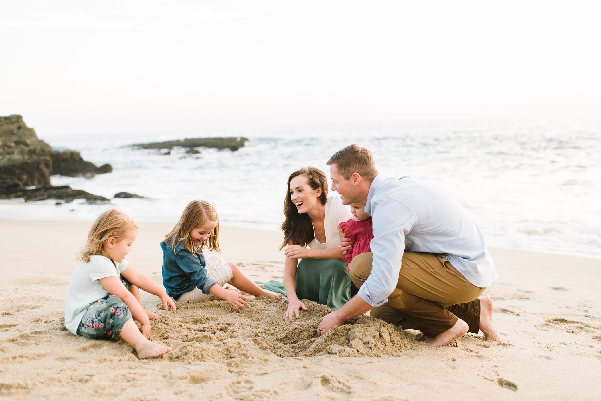 Playful sunset beach family photos in California at Laguna Beach