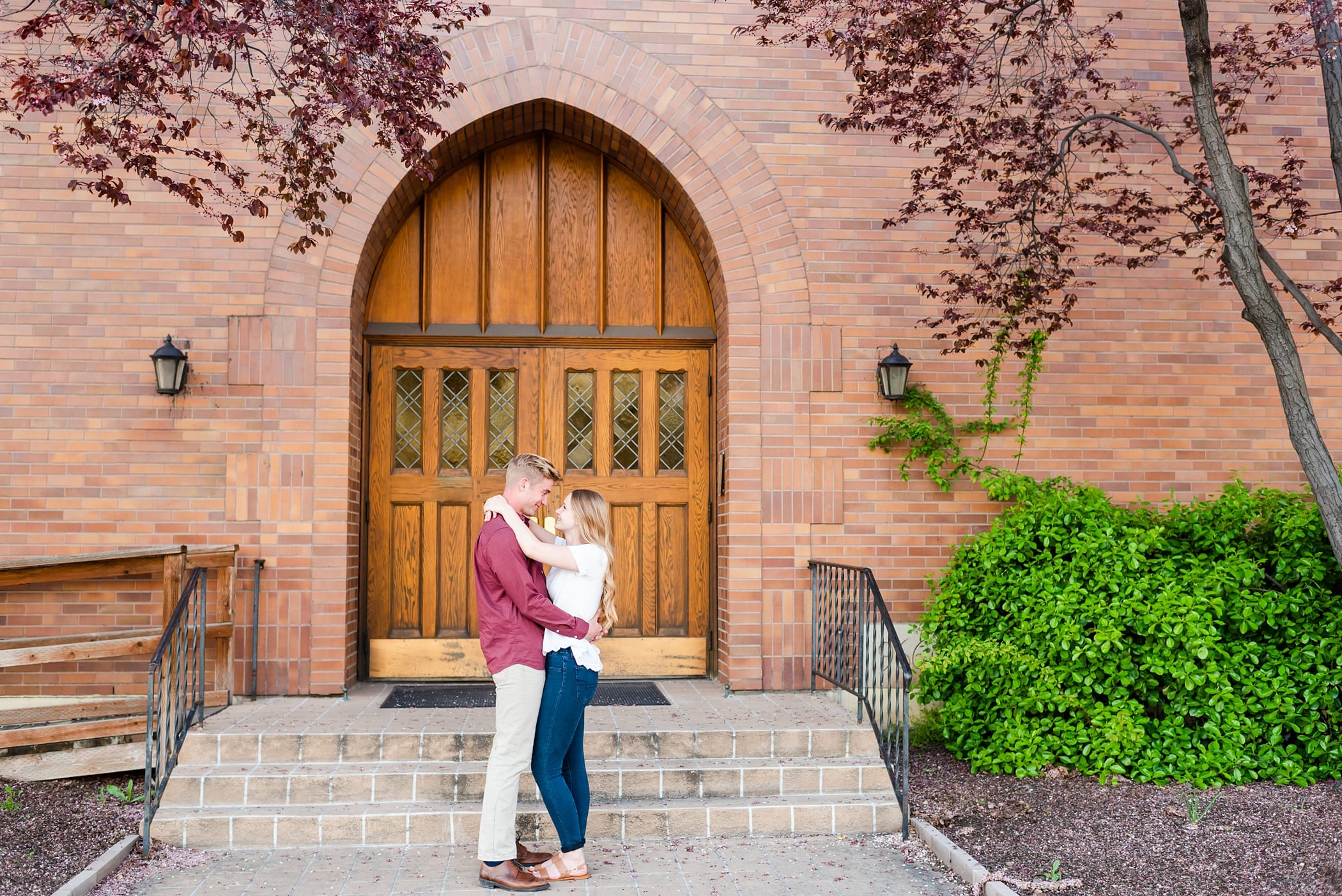 downtown engagements with brick arches and old doors