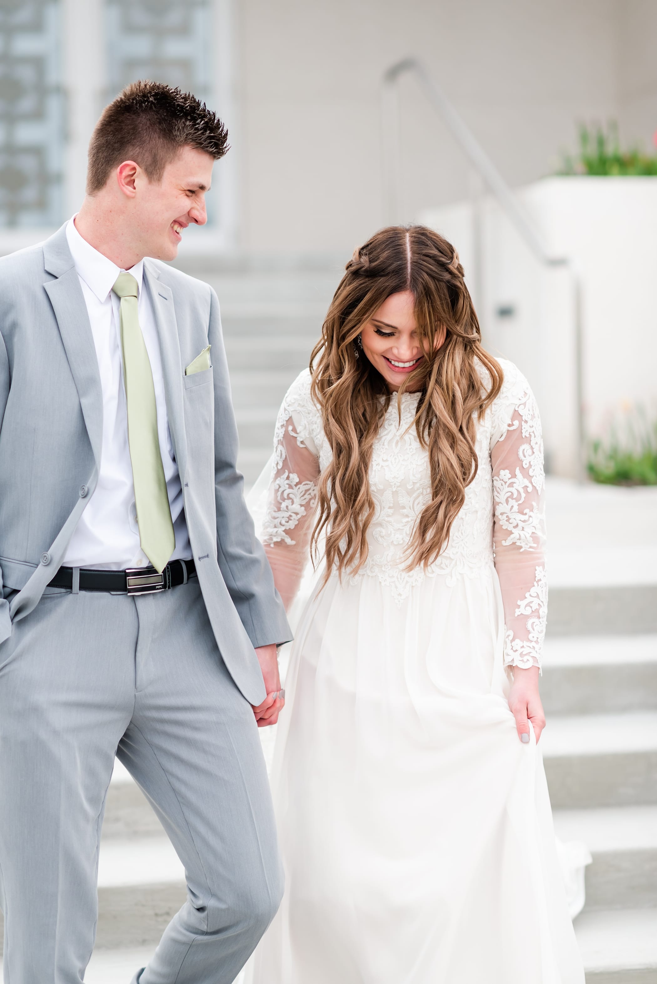 Wedding couple walking photo with laughter