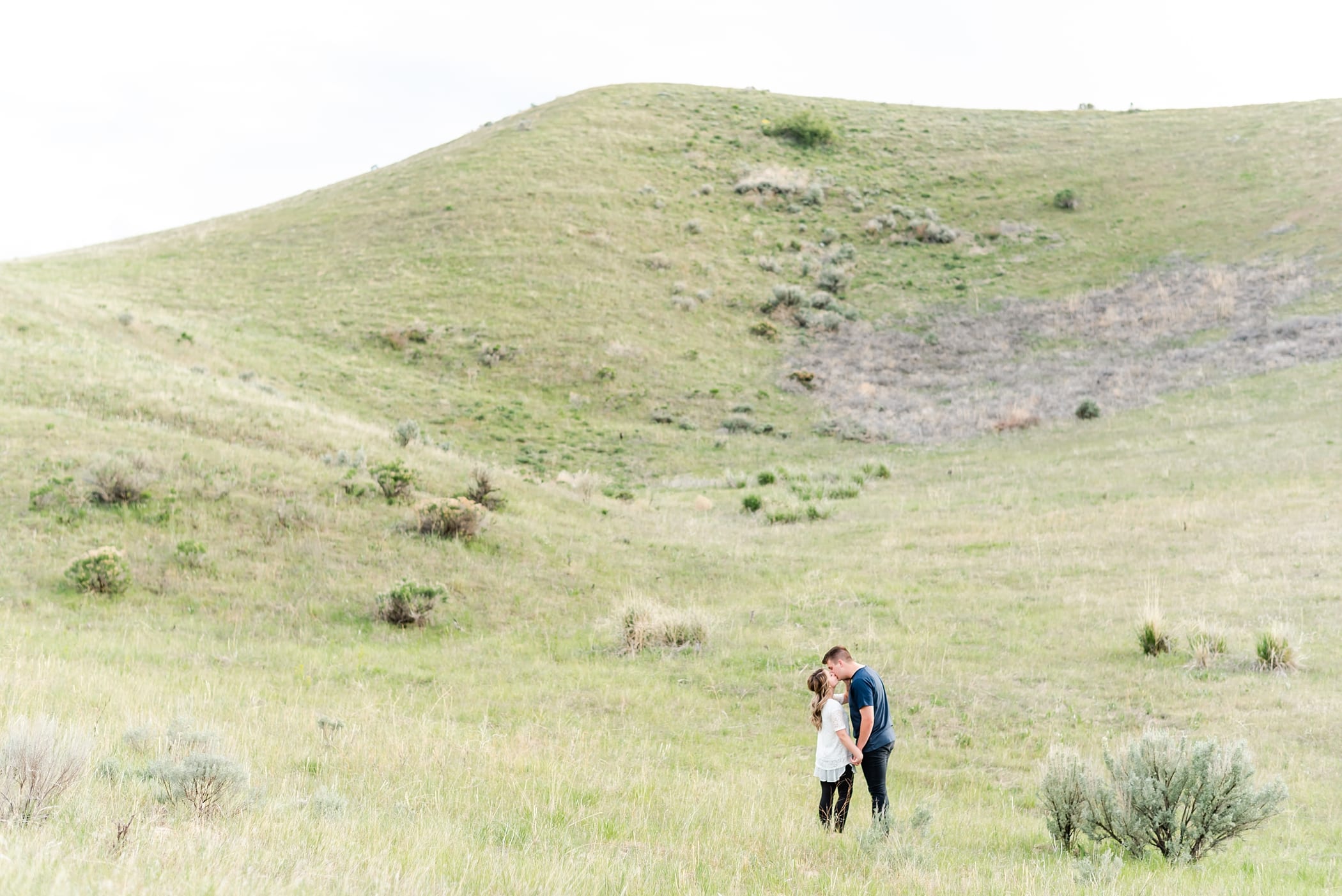 Rolling green hills engagement session in Idaho